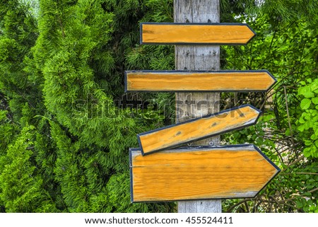 four Signboard in green garden with green background