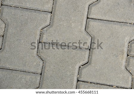 Grey paving slabs as a background close-up image