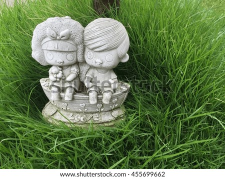 Cute dolls in garden close up