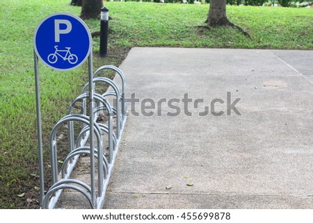 Bicycle parking sign in public park, security and safety concept