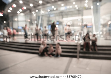 Blurred image of people shopping at night market use for background