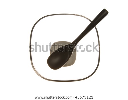 bamboo spoon on empty glass plate