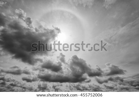 Cloudy stormy black and white dramatic sky with sun rays, Dark ominous grey storm clouds, Dark clouds background