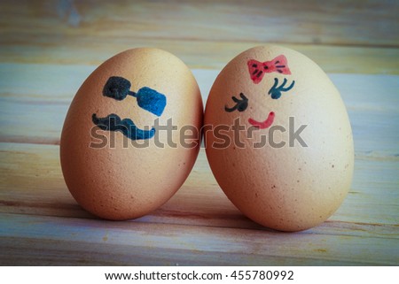 Unusual eggs with the muzzle. The love of two eggs.