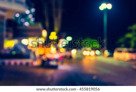 Vintage tone of road and footpath in night time with bokeh for background usage.