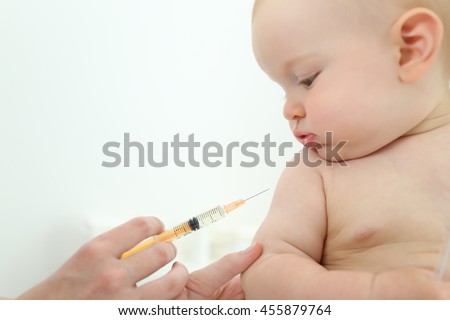 Doctor vaccinating baby Royalty-Free Stock Photo #455879764