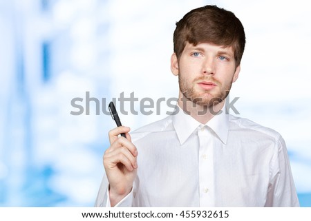 attractive businessman or teacher with marker writing or drawing something