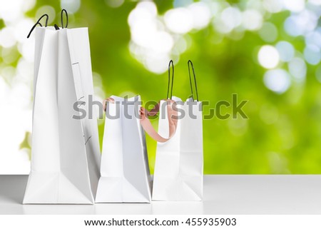 Shopping Bag of presents on white table.