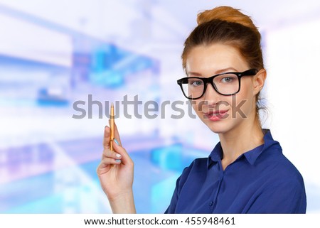 Businesswoman write on a glass board