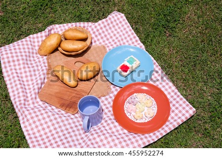 Picnic for a summer vacation with potato , snack and cake.