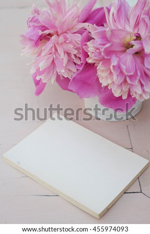 mockup with peony. pink background. notebook with your text