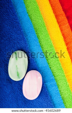 Colour terry towels and piece of toilet soap