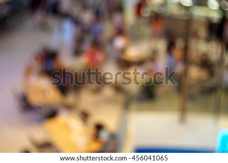 Blurred abstract background of people walking in mall