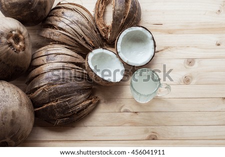 Coconuts on old wood table background / copy space