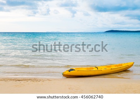 Yellow kayak on the tropical beach and clear blue sky from Thailand