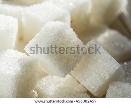 Close up shot of white refinery sugar. Royalty-Free Stock Photo #456082459