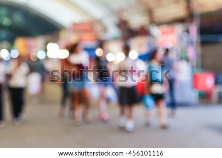 motion blurred shoppers. Long time daytime blurred shot