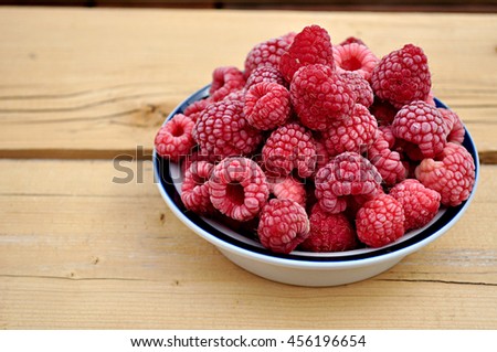 frozen raspberries in a bowl