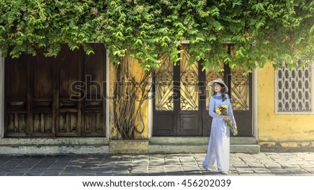Portrait of Vietnamese girl traditional dress, Ao dai is famous traditional costume for woman in Vietnam Royalty-Free Stock Photo #456202039