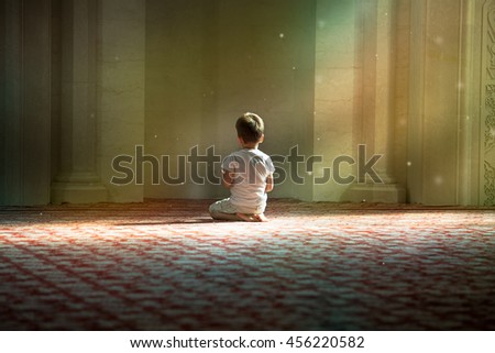 praying child in the White Mosque in Bulgar Royalty-Free Stock Photo #456220582