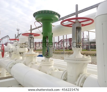 Green pneumatic valve on the pipeline. The equipment of the oil plant.                             