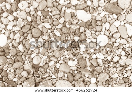 Sea stones laid out in the form of a circle,background texture