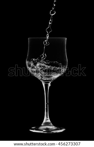 Drink Cocktail splash of  glass on a black background.