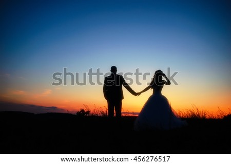 Couple in love silhouette during sunset