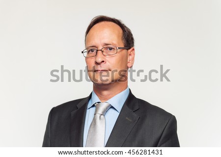 Close up portrait of middle-age man in formalwear  Royalty-Free Stock Photo #456281431