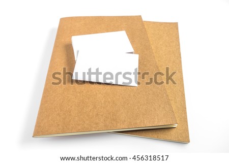 Blank business card, book with soft shadows.