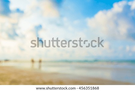 Abstract blur image of sea shore and blue sky for background usage .