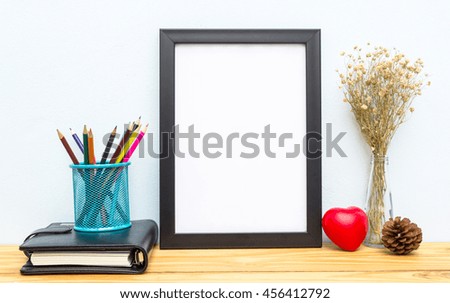 Mock up blank photo frame on table