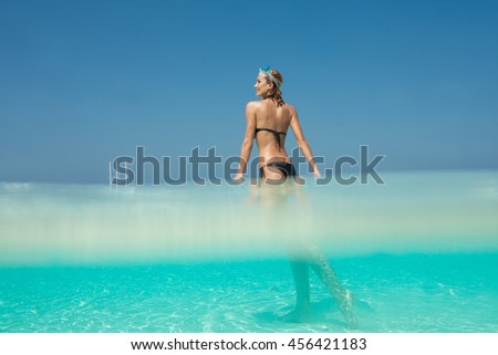 woman in the transparent sea with diving mask
