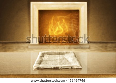 background of fireplace and napkin on brown table 