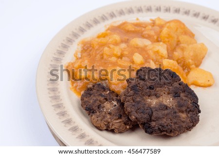 Serbian minced meat hamburger with mashed potatoes on the plate.