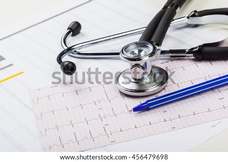 metal stethoscope on cardiogram