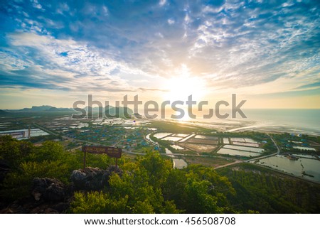 Sunrise in the tropical forest mountain with sea background