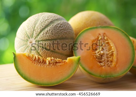 slice of ripe melon on table Royalty-Free Stock Photo #456526669