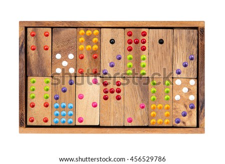 Wooden dominoes in a wooden box isolated on white background