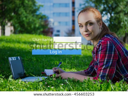 account registration concept - portrait of young woman with laptop in summer park