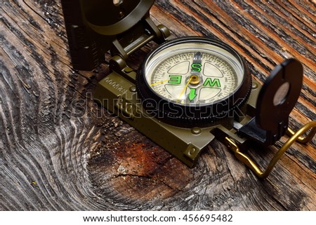 compass on wooden surface
