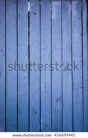 wooden planks with cracked blue color paint texture background