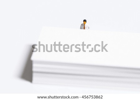 Businessman looking at white paper