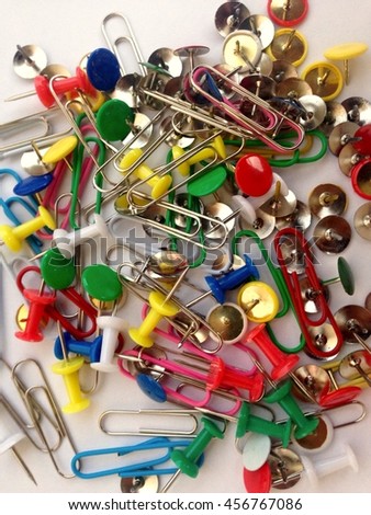 Multi-colored paper clips, pins
