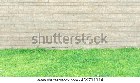 brick wall with grass floor