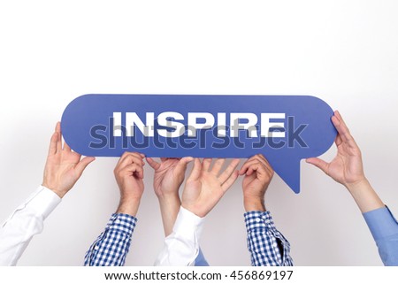 Group of people holding the INSPIRE written speech bubble