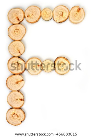 Alphabet letters made from Wood slice on white Background.F