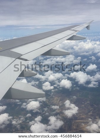 cloud sky with wing of airplane
