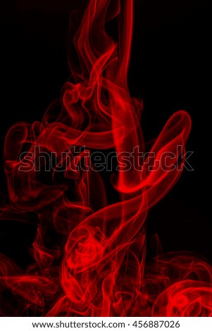 Red smoke abstract on black background, Movement of red smoke, darkness concept