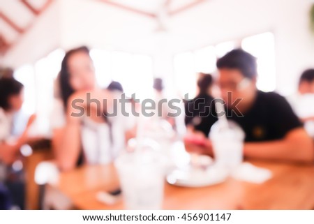Blurred image of people in cafe.